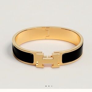 - Hermès Gold and Black Clic H Bracelet